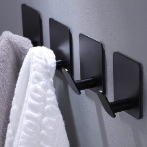 DELITON Ganchos adhesivos – Paquete de 4 ganchos de pared para toallas/abrigos, para baño o cocina (negro mate, acero inoxidable)