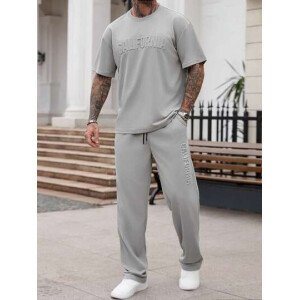 Manfinity Homme Conjunto de camiseta de manga corta casual con estampado de letras en relieve y pantalones largos con cordón en la cintura, para hombre, de verano
