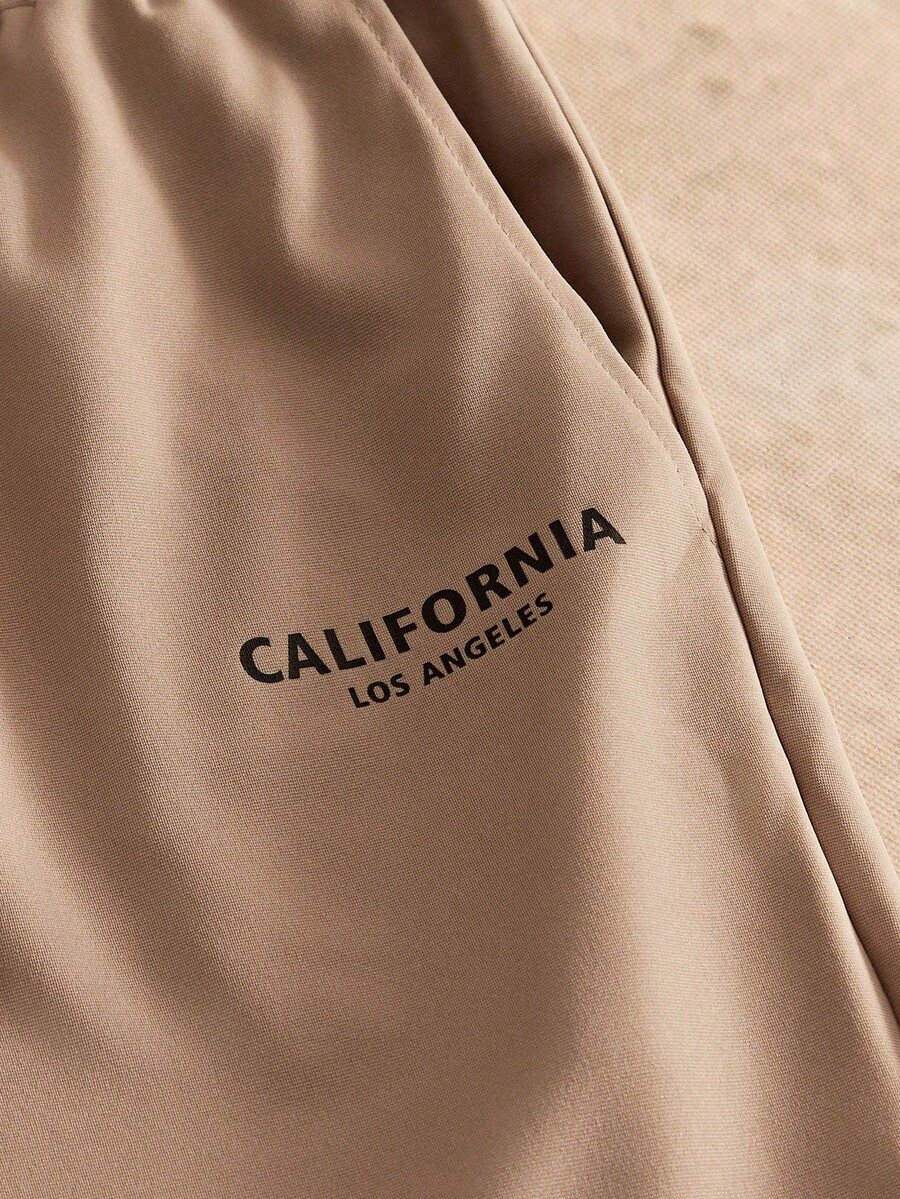 Manfinity NXTstreet 2 piezas Conjunto casual de camiseta de manga corta con cuello redondo y estampado de águila, y pantalones largos con cordón en la cintura y estampado de letras para hombre, atuendo cómodo - Imagen 33